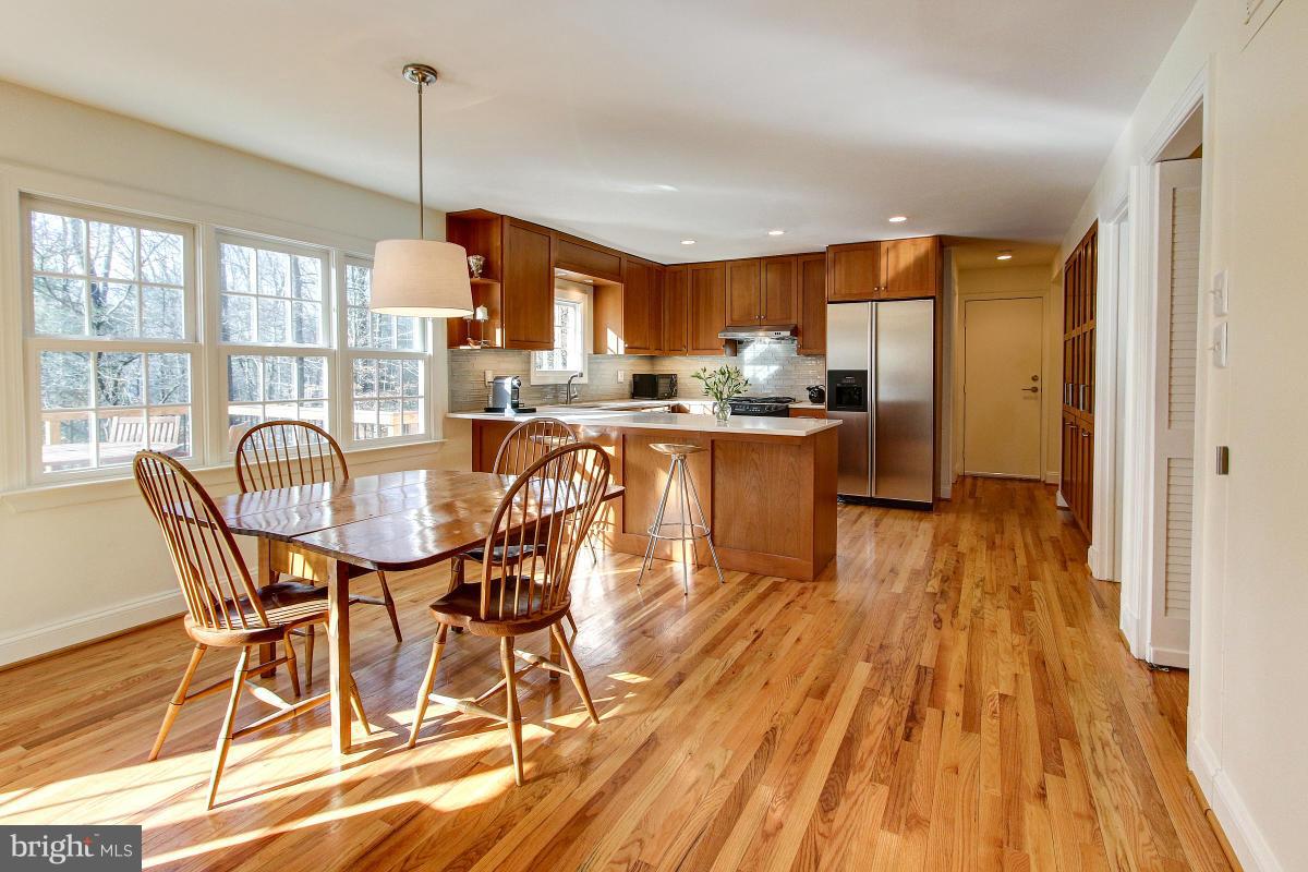 11419 Running Cedar Road Reston, VA 20191 - Photo 9 of 30 a view of a dining room with furniture window and wooden floor