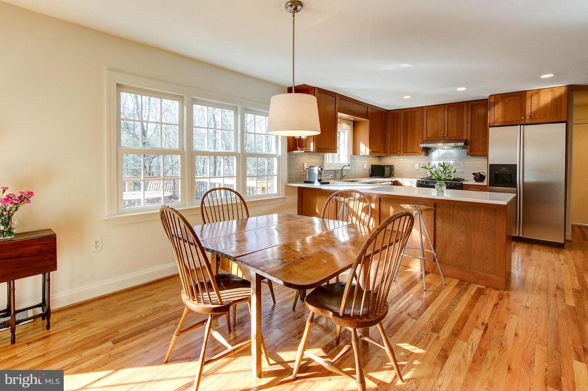 11419 Running Cedar Road Reston, VA 20191 - Photo 10 of 30 a view of a dining room with furniture window and wooden floor