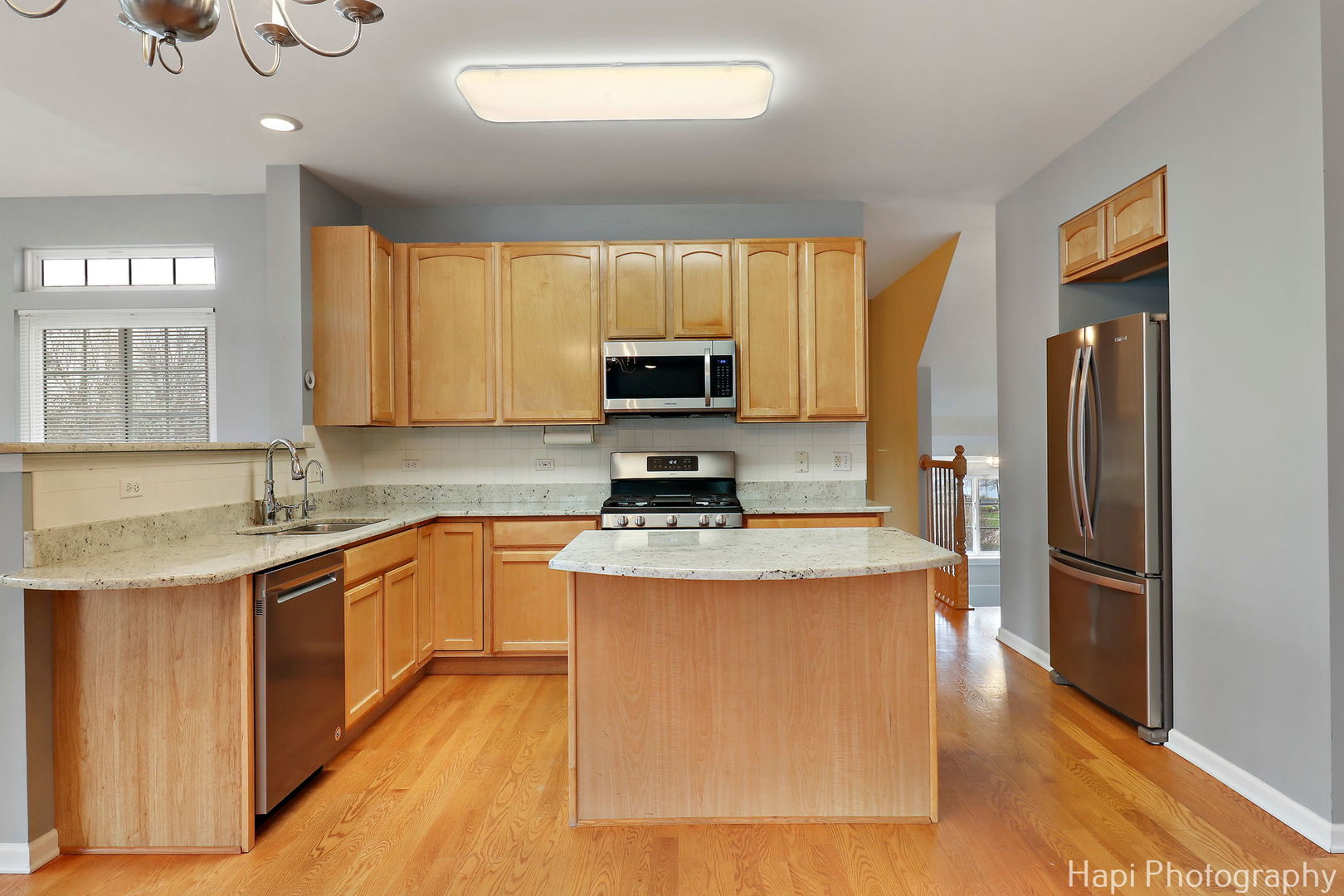 123 Norman Drive McHenry, IL 60050 - Photo 9 of 33 a kitchen with stainless steel appliances granite countertop a refrigerator a stove top oven a sink and dishwasher