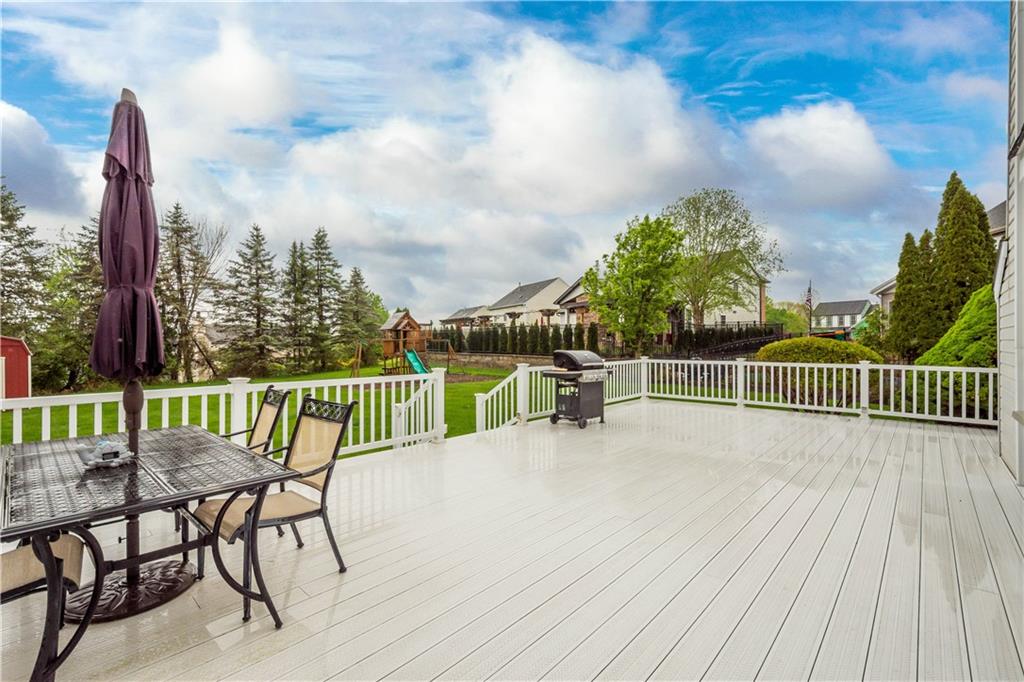 602 Birch Court Bridgeville, PA 15017 - Photo 15 of 47 a view of a roof deck with table and chairs and wooden floor