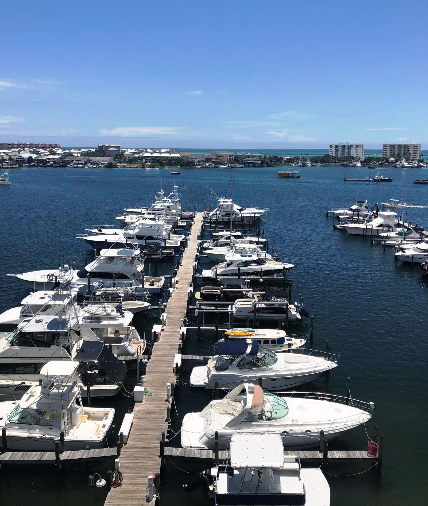 320 Harbor Boulevard, Unit 502 Destin, FL 32541 - Photo 21 of 22 an aerial view of a house with boats and trees all around