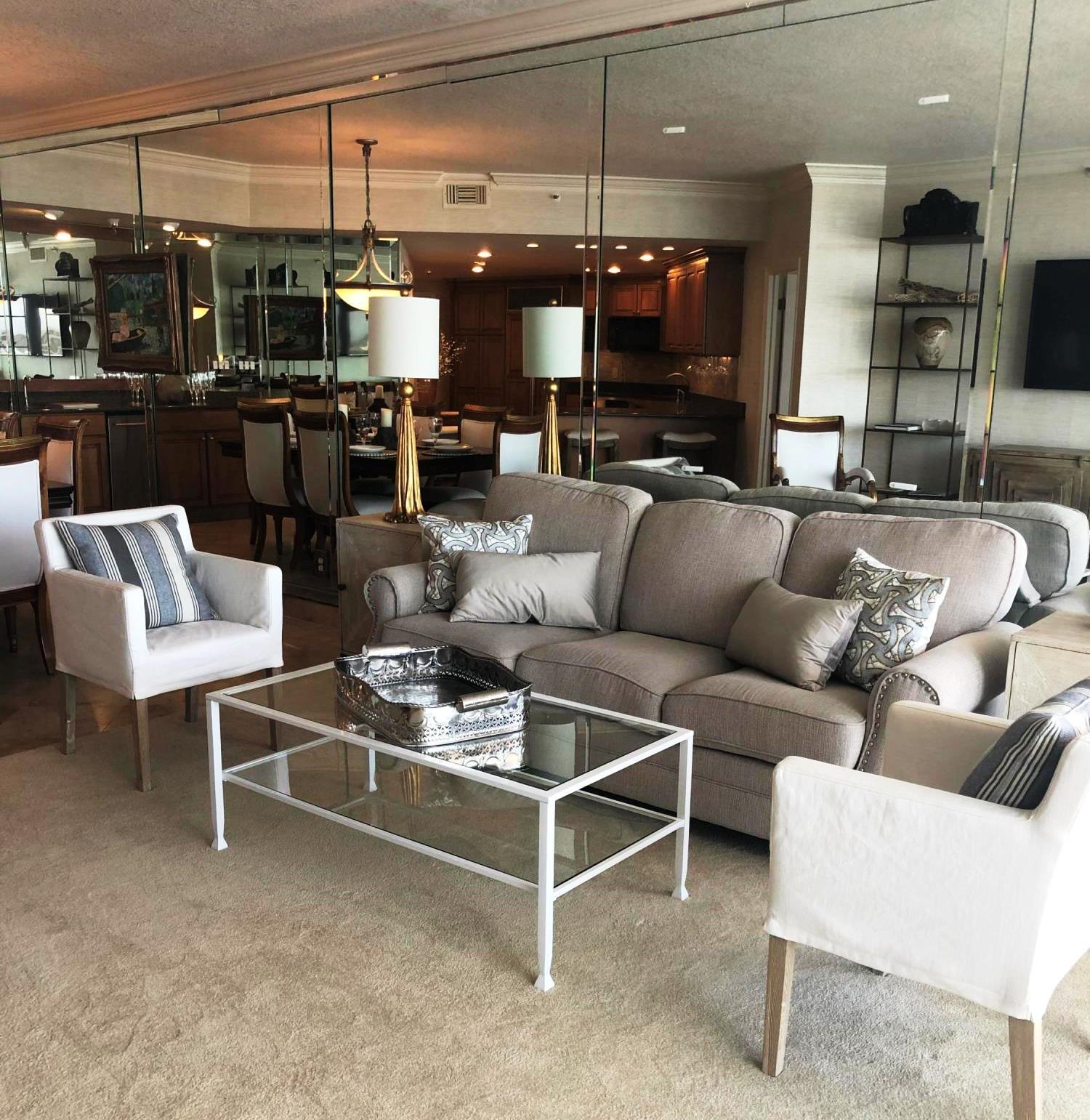 320 Harbor Boulevard, Unit 502 Destin, FL 32541 - Photo 4 of 22 a living room with furniture a flat screen tv and kitchen view