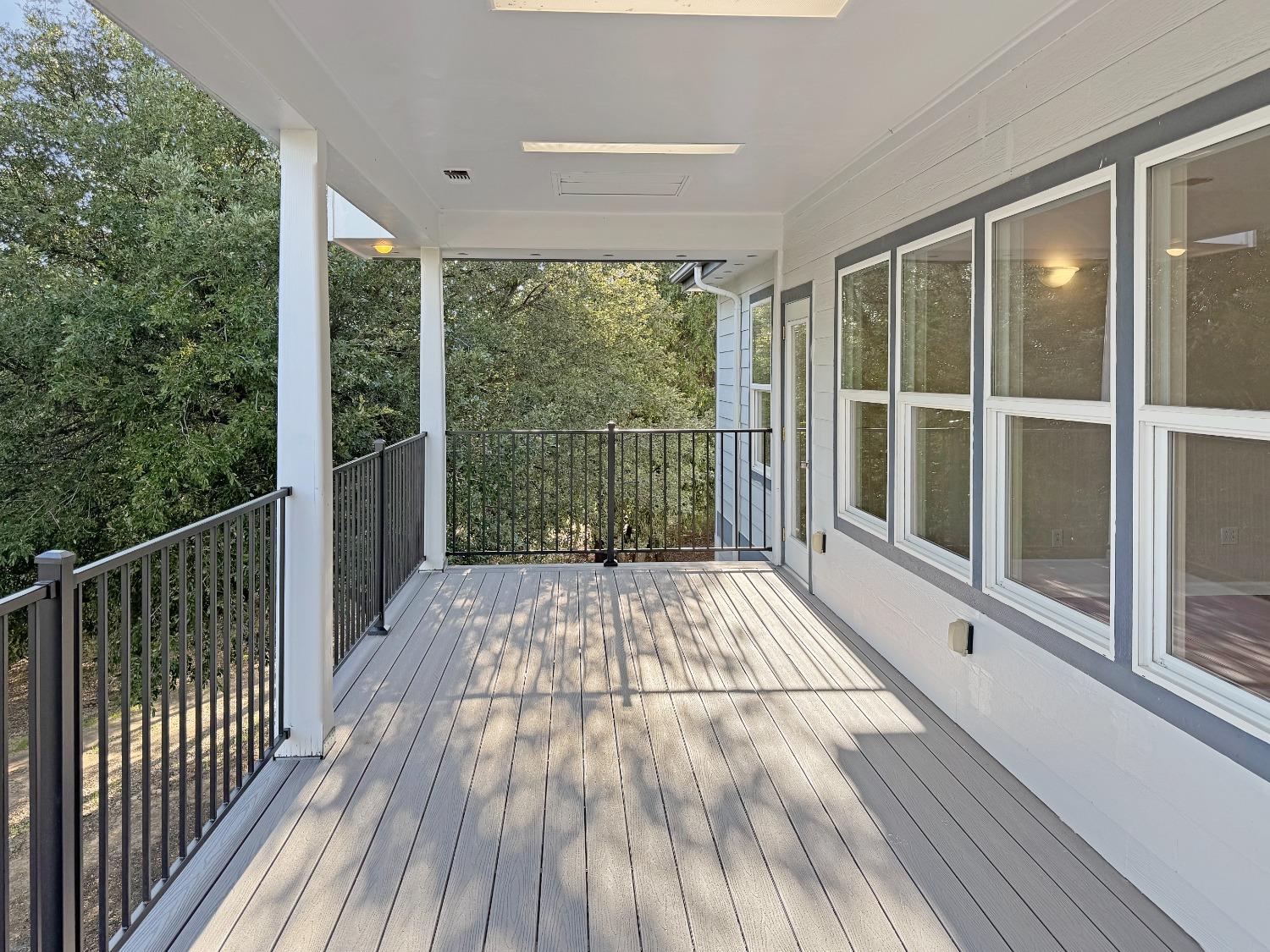 10095 Birchville Road Nevada City, CA 95959 - Photo 12 of 38 a view of balcony with floor to ceiling window and wooden floor