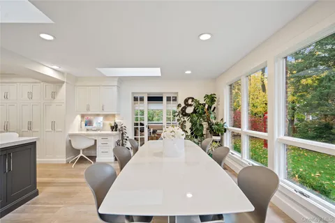 a view of a dining room with furniture window and outside view