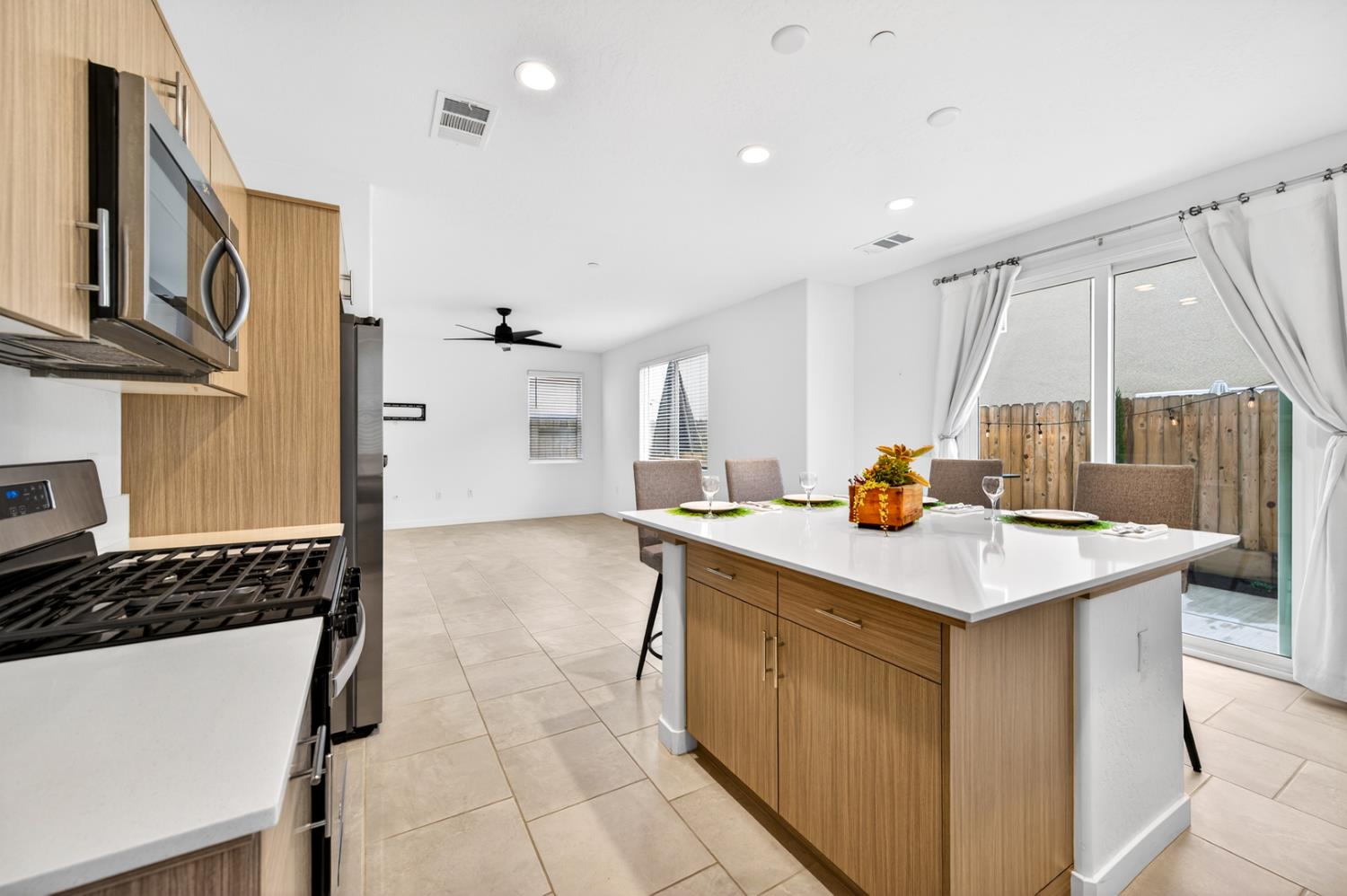 317 Talus Way South Madera, CA 93636 - Photo 11 of 61 a kitchen with stainless steel appliances a sink and a stove
