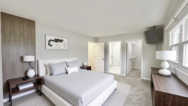 a bedroom with a bed and window