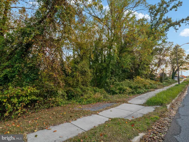 an aerial view of residential houses with city view