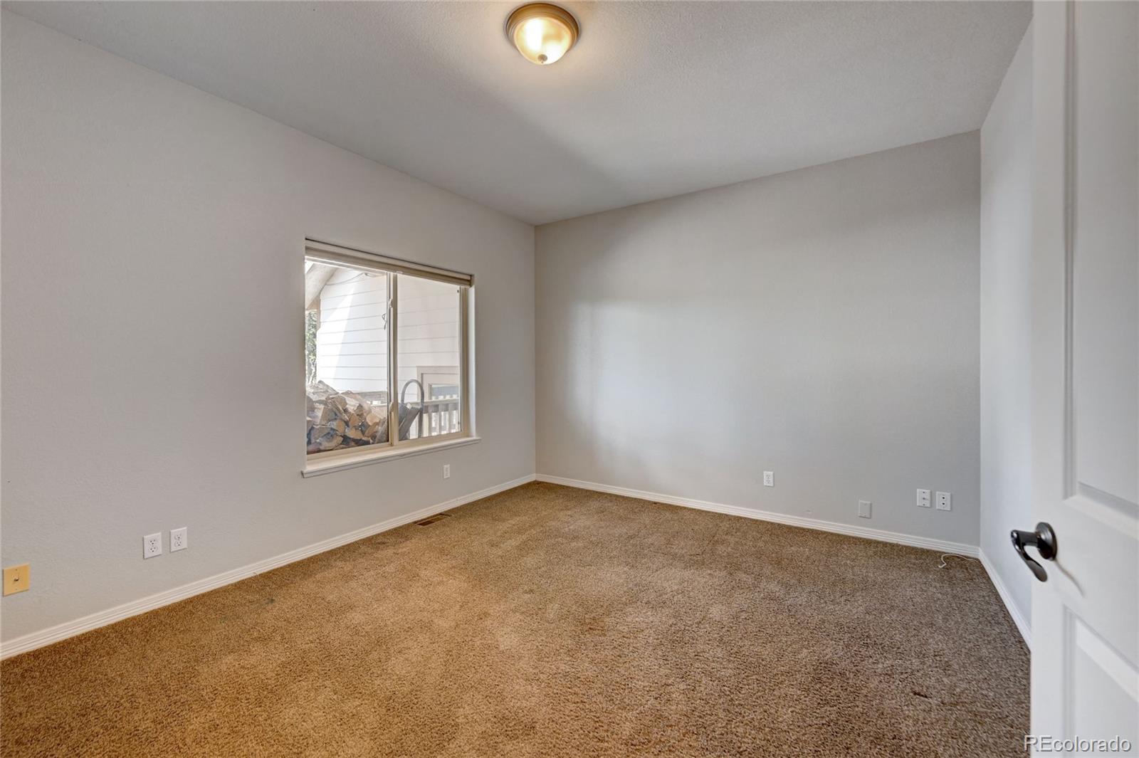 13093 Lori Drive Conifer, CO 80433 - Photo 11 of 36 an empty room with windows