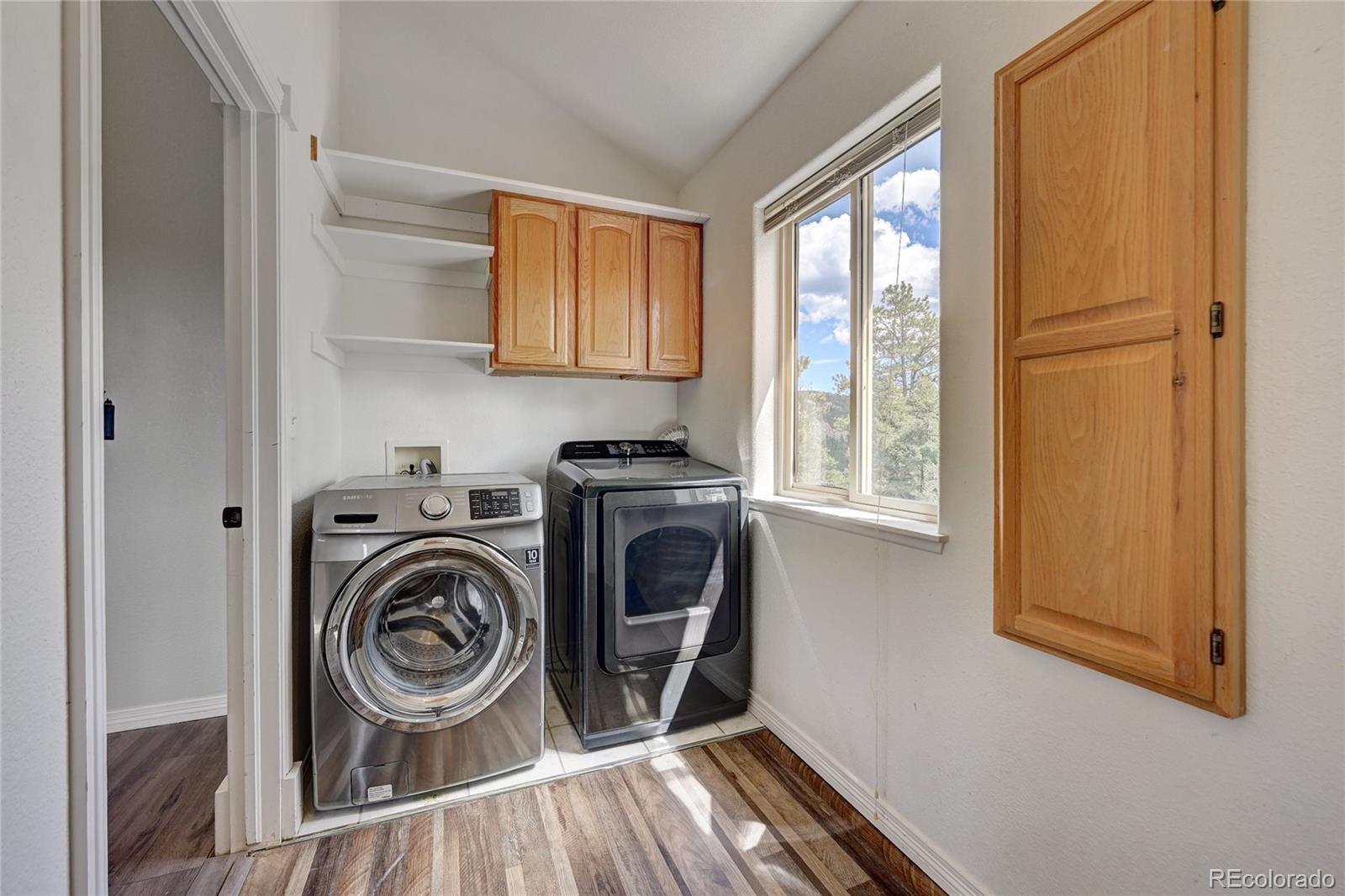 13093 Lori Drive Conifer, CO 80433 - Photo 14 of 36 a utility room with sink dryer and washer