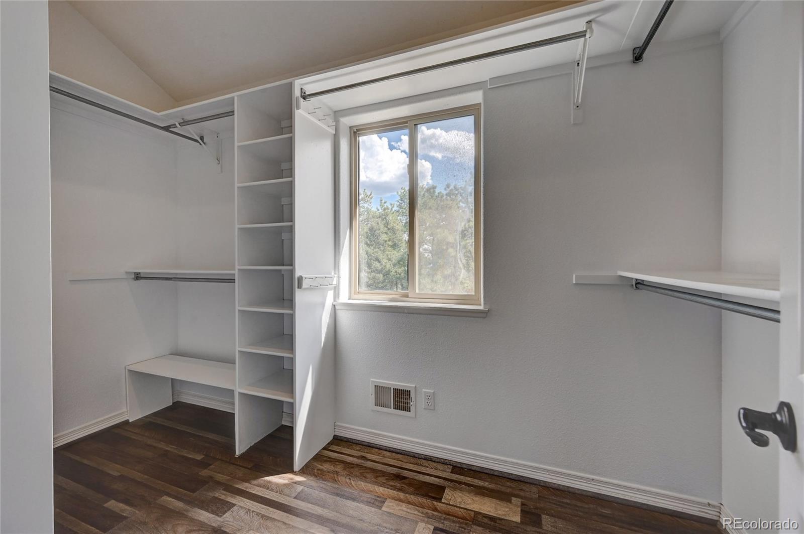 13093 Lori Drive Conifer, CO 80433 - Photo 16 of 36 a view of walk in closet with empty racks