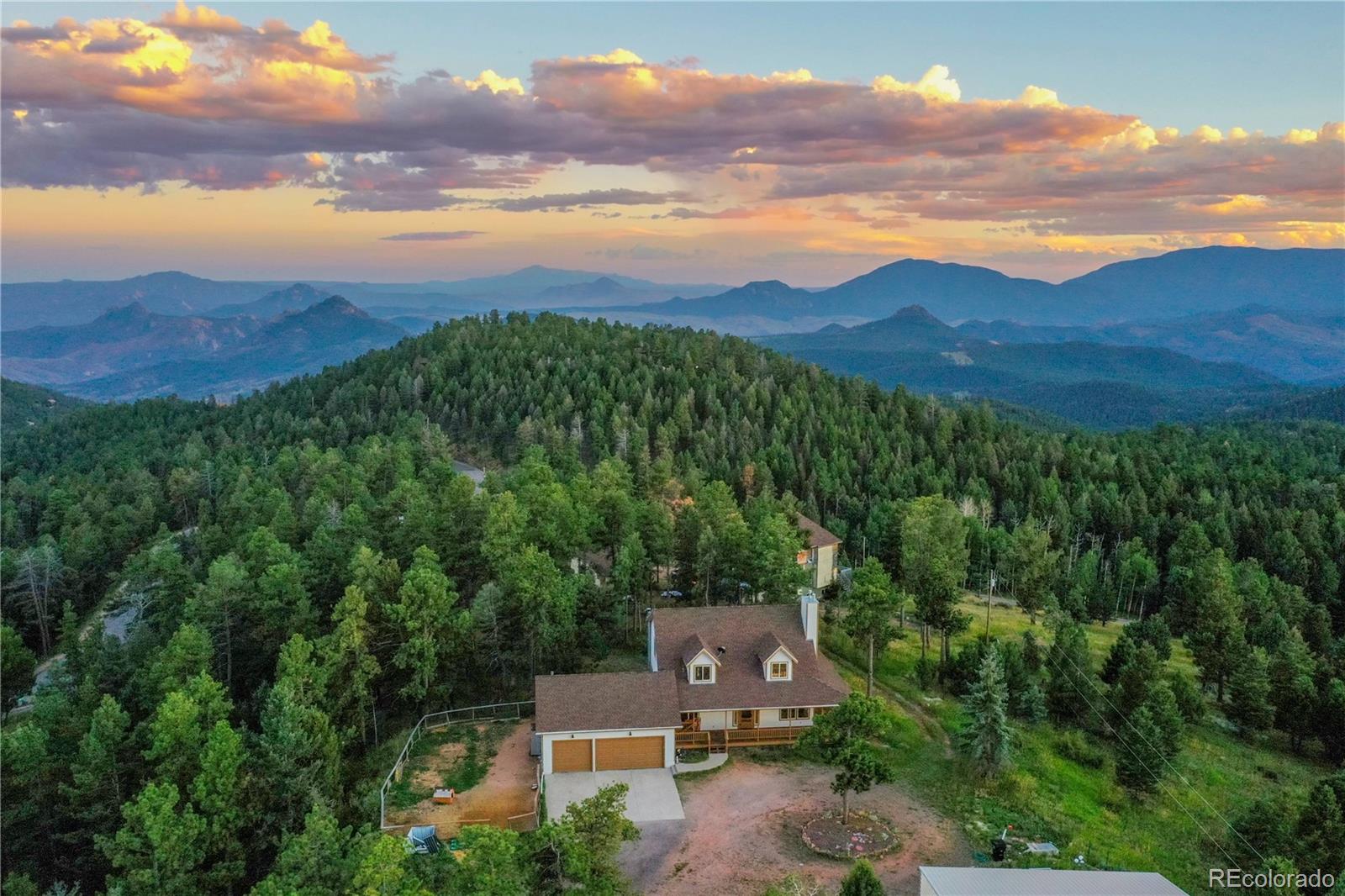 13093 Lori Drive Conifer, CO 80433 - Photo 31 of 36 a view of a city with lush green forest
