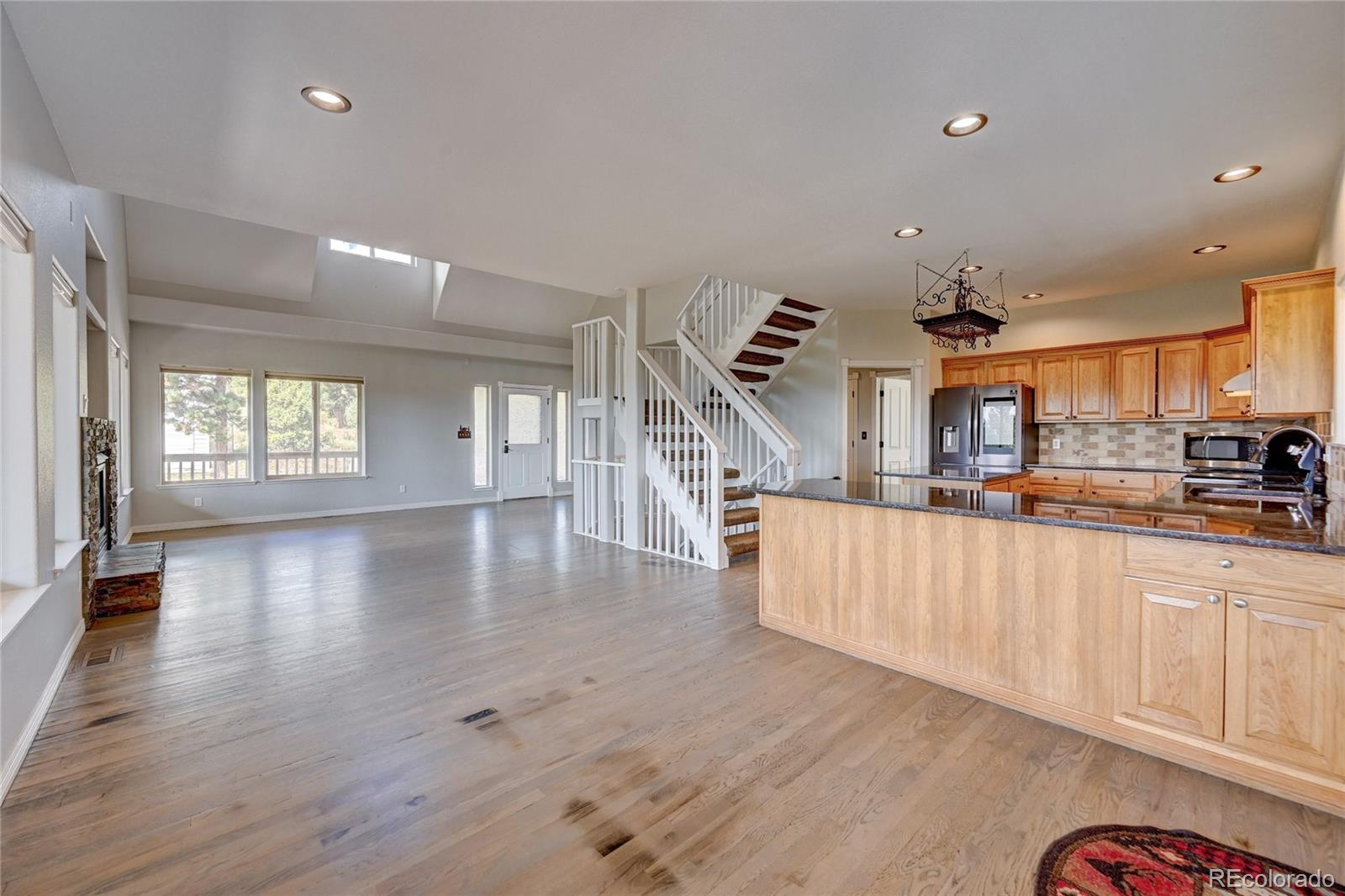 13093 Lori Drive Conifer, CO 80433 - Photo 6 of 36 a view of a kitchen with furniture and wooden floor