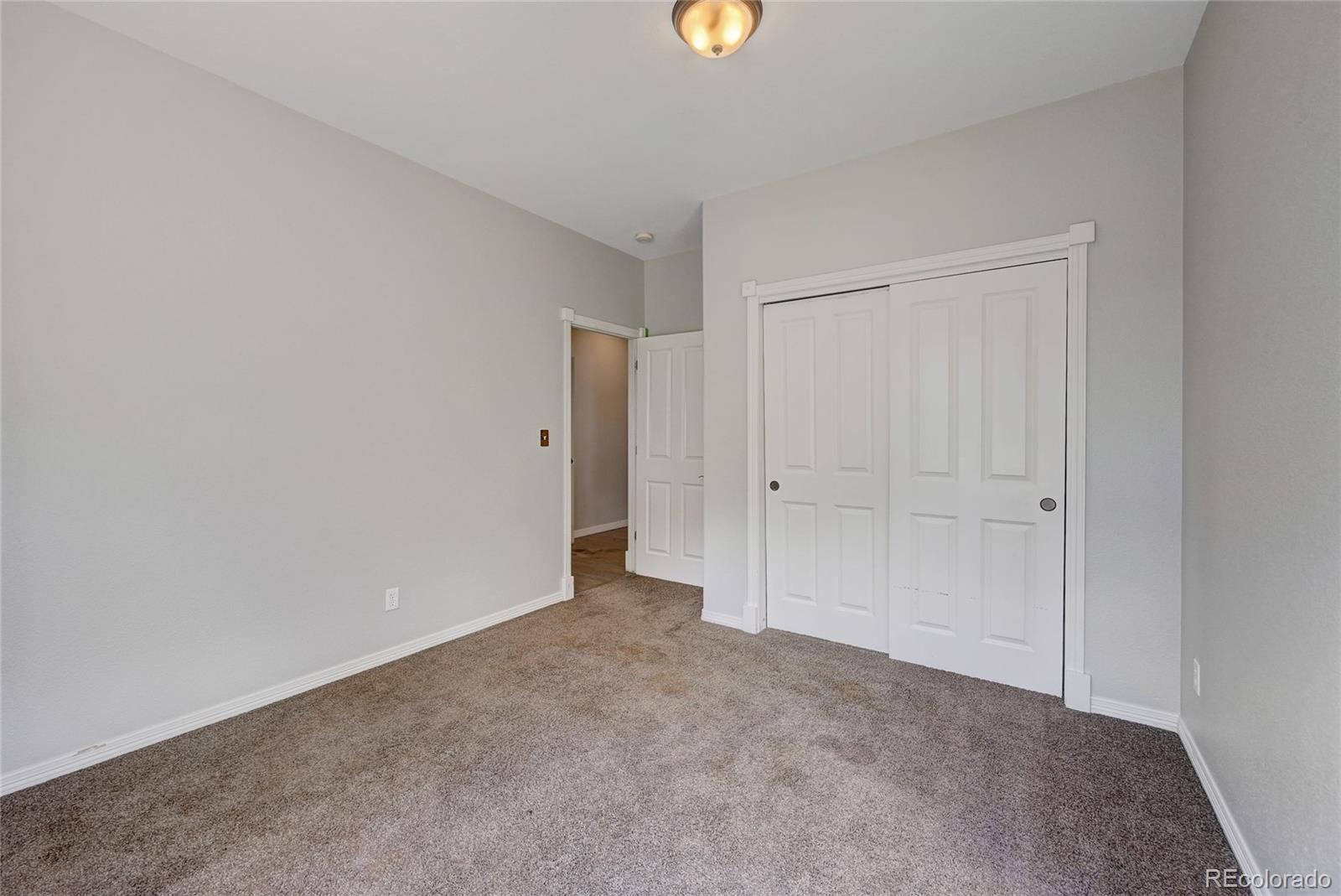 13093 Lori Drive Conifer, CO 80433 - Photo 9 of 36 a view of an empty room and window