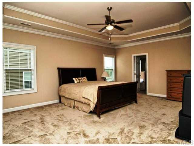 2736 Royal Forrest Drive Raleigh, NC 27614 - Photo 8 of 22 WOW! What an amazing owner's suite! This expansive space boasts a trey ceiling, crown molding and wonderful owner's bath. Master Bedroom