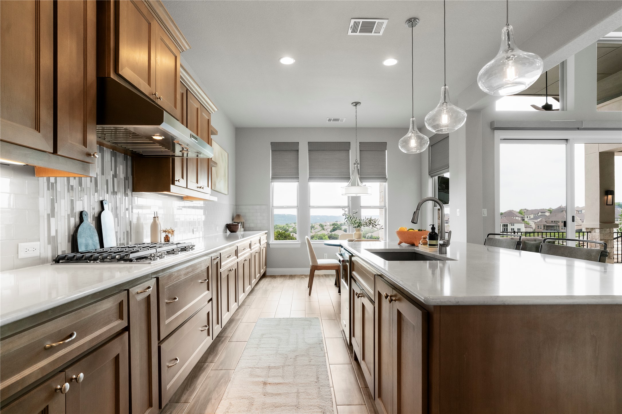 2033 Portobello Road Leander, TX 78641 - Photo 17 of 39 The cabinetry extends into a casual dining space.