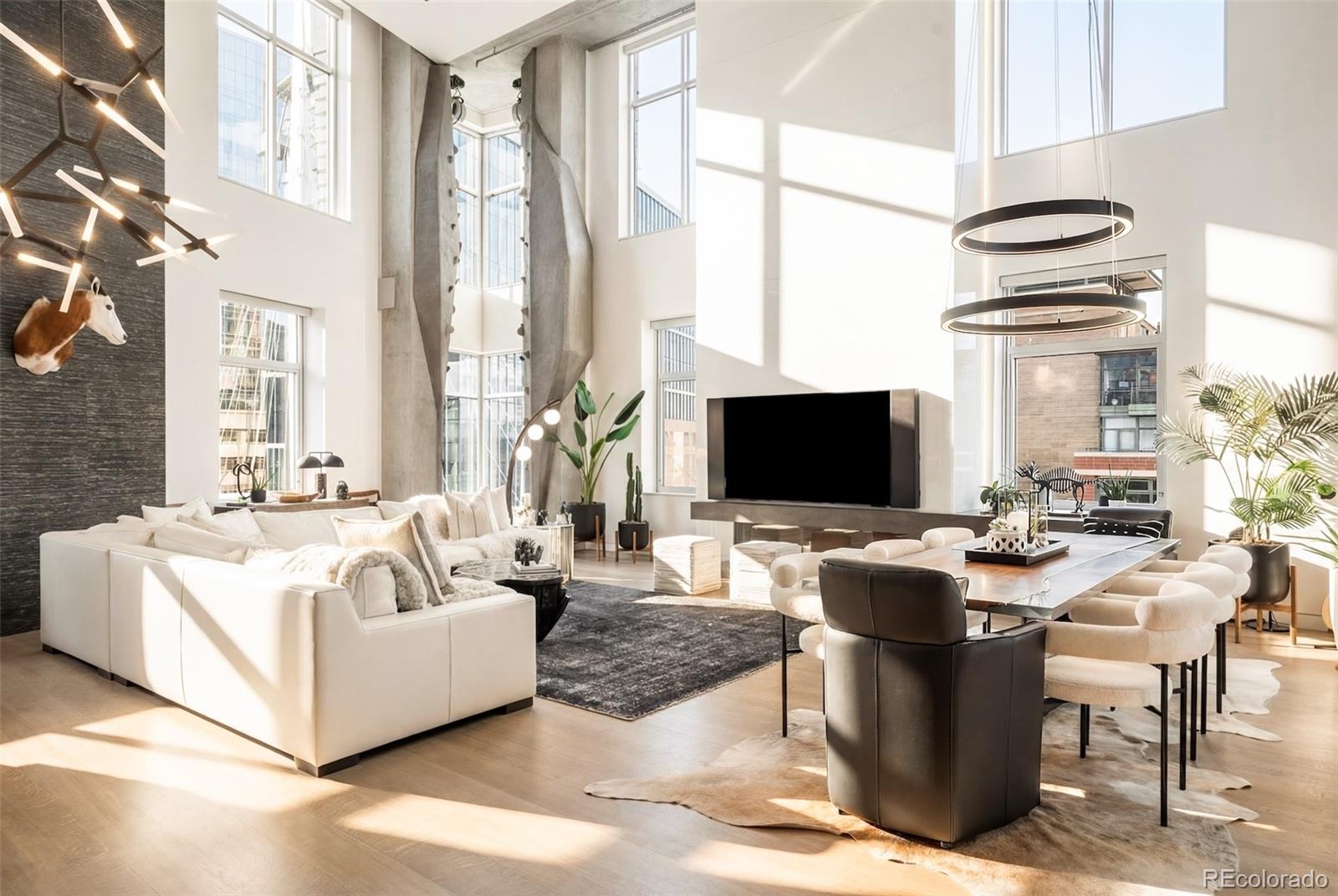 a living room with fireplace furniture and a flat screen tv