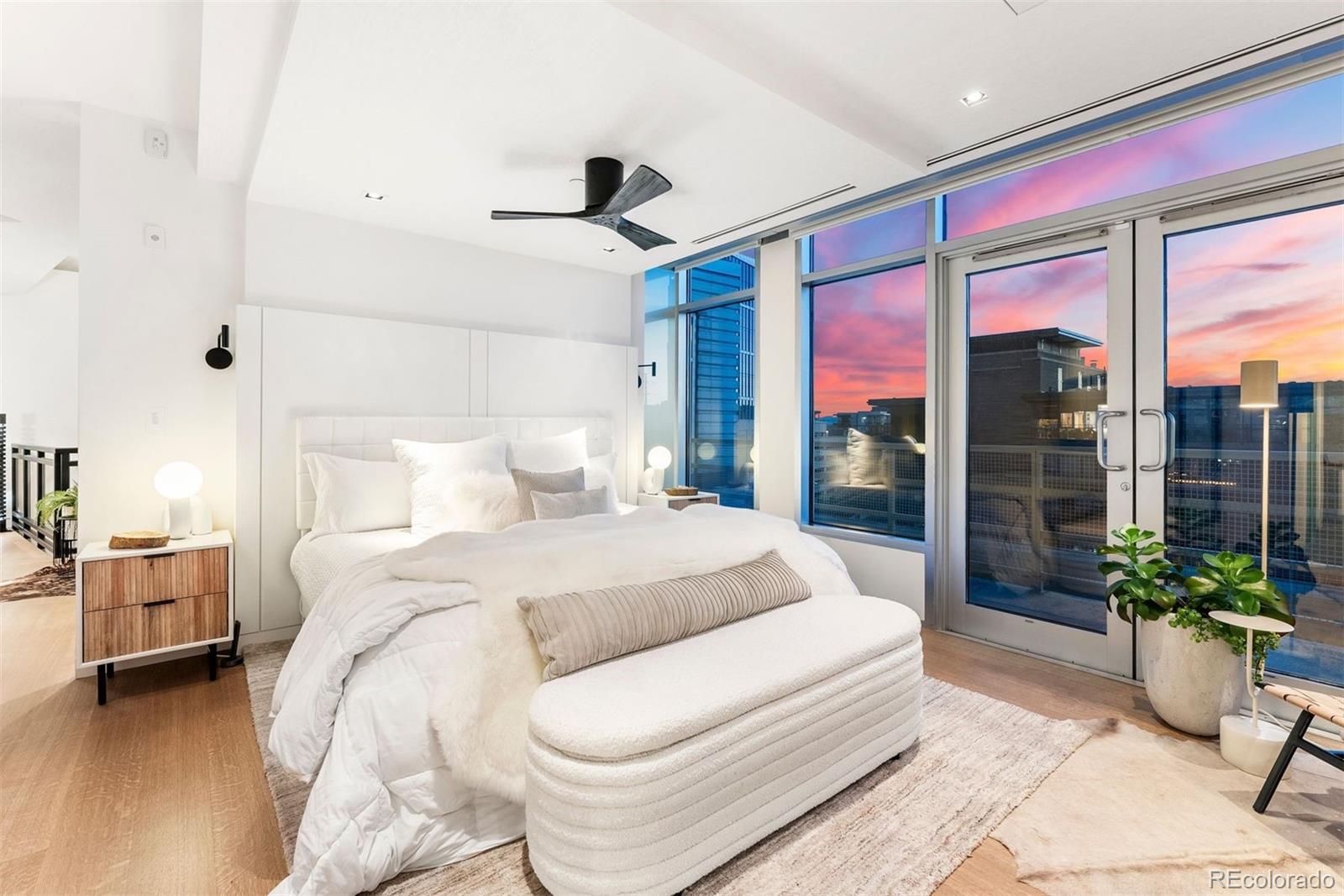 1610 Little Raven Street, Unit PH6 Denver, CO 80202 - Photo 24 of 41 a bedroom with a large bed and a potted plant