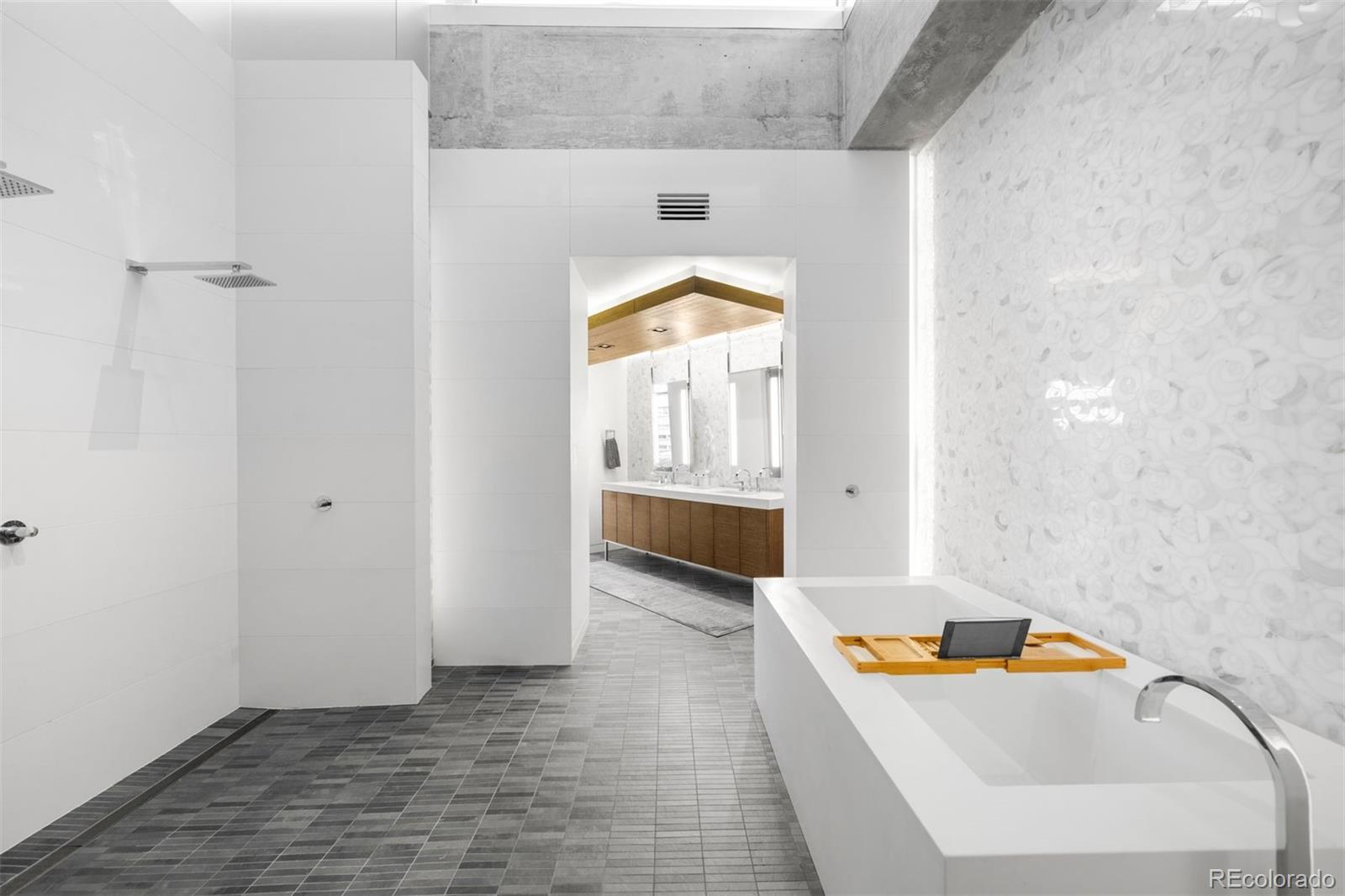 1610 Little Raven Street, Unit PH6 Denver, CO 80202 - Photo 27 of 41 a bathroom with a sink and a tub