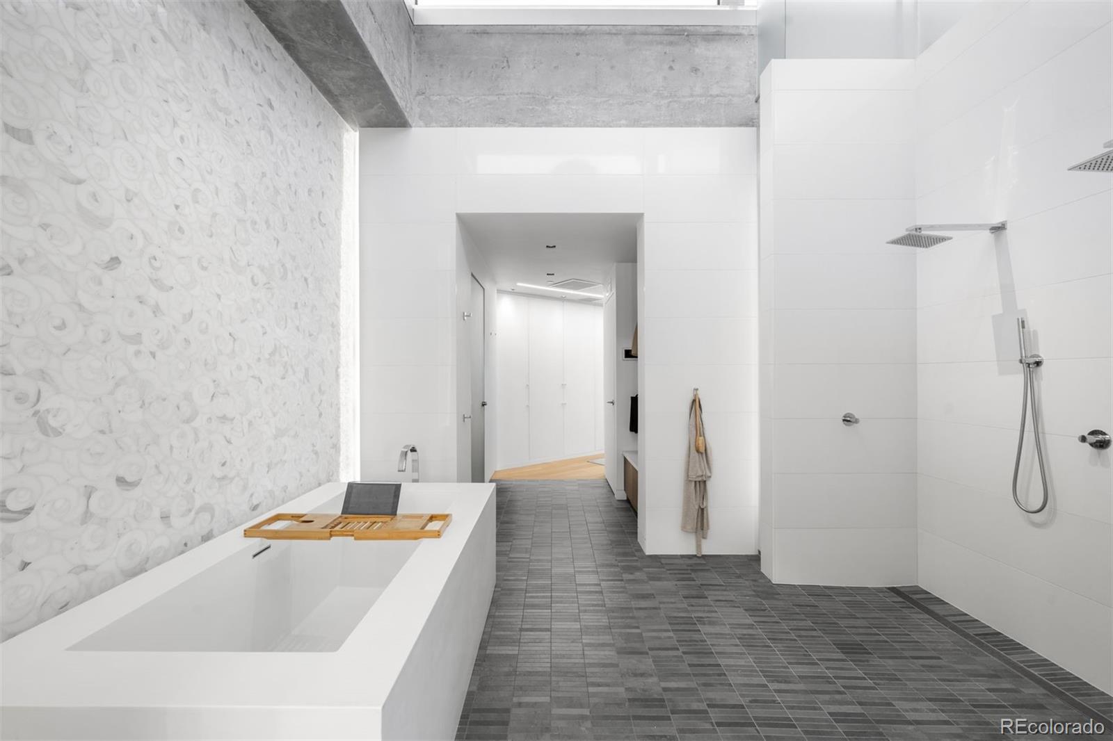 1610 Little Raven Street, Unit PH6 Denver, CO 80202 - Photo 29 of 41 a bathroom with a bathtub and a sink