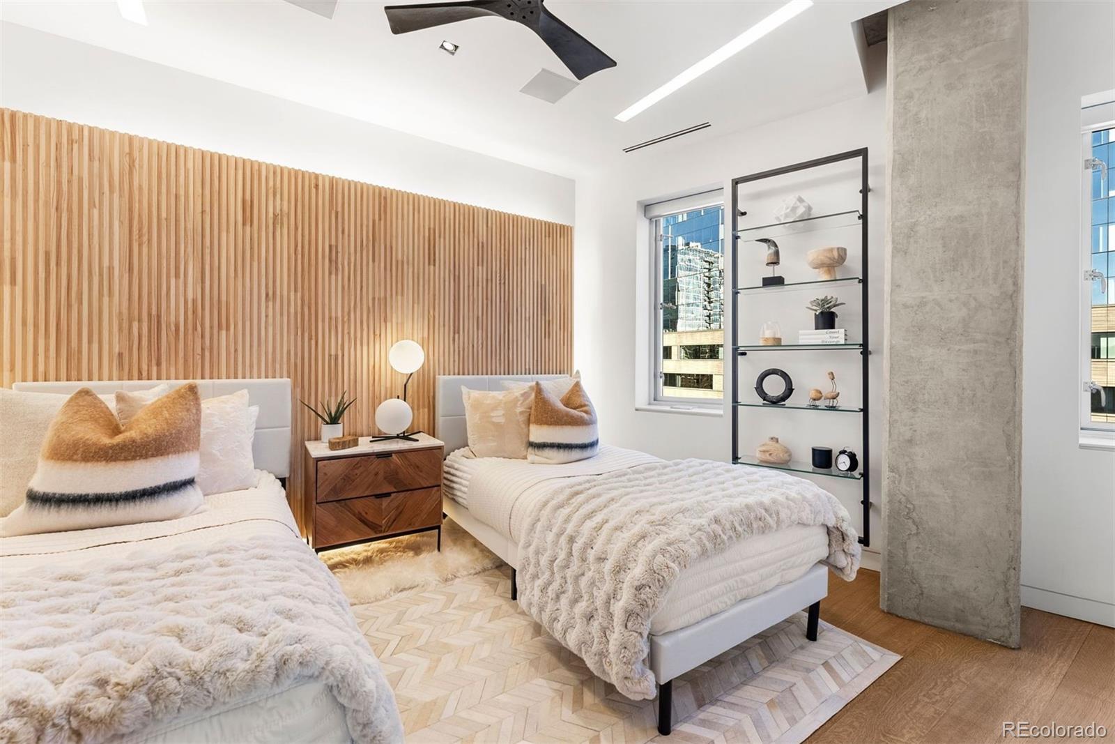 1610 Little Raven Street, Unit PH6 Denver, CO 80202 - Photo 34 of 41 a bedroom with a bed and wooden floor