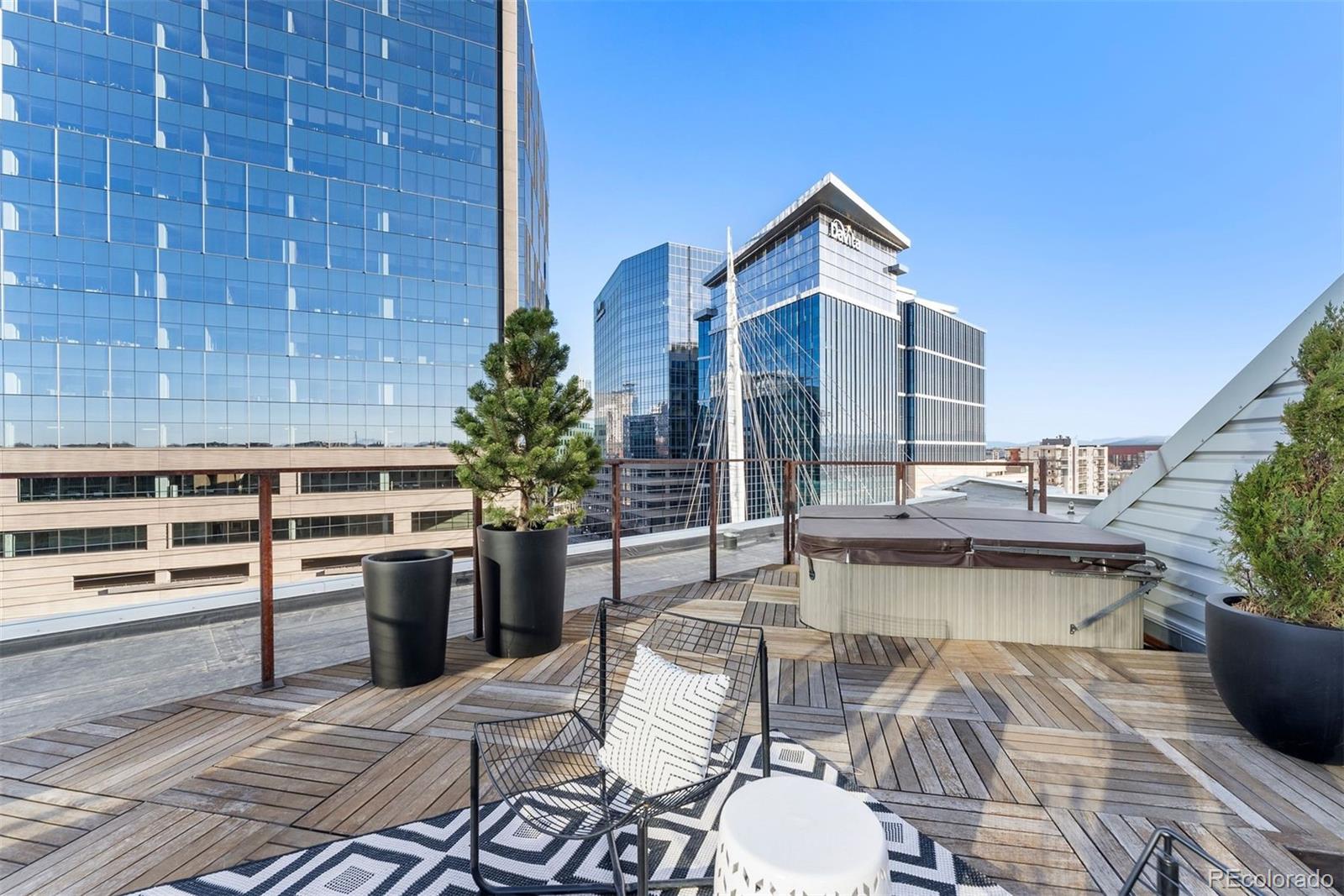 1610 Little Raven Street, Unit PH6 Denver, CO 80202 - Photo 37 of 41 a view of a patio with chairs and tables