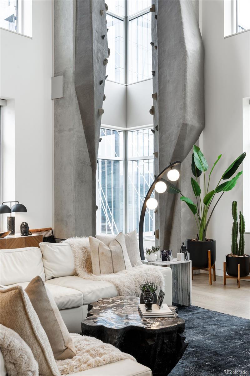 1610 Little Raven Street, Unit PH6 Denver, CO 80202 - Photo 7 of 41 a living room with furniture and a large window