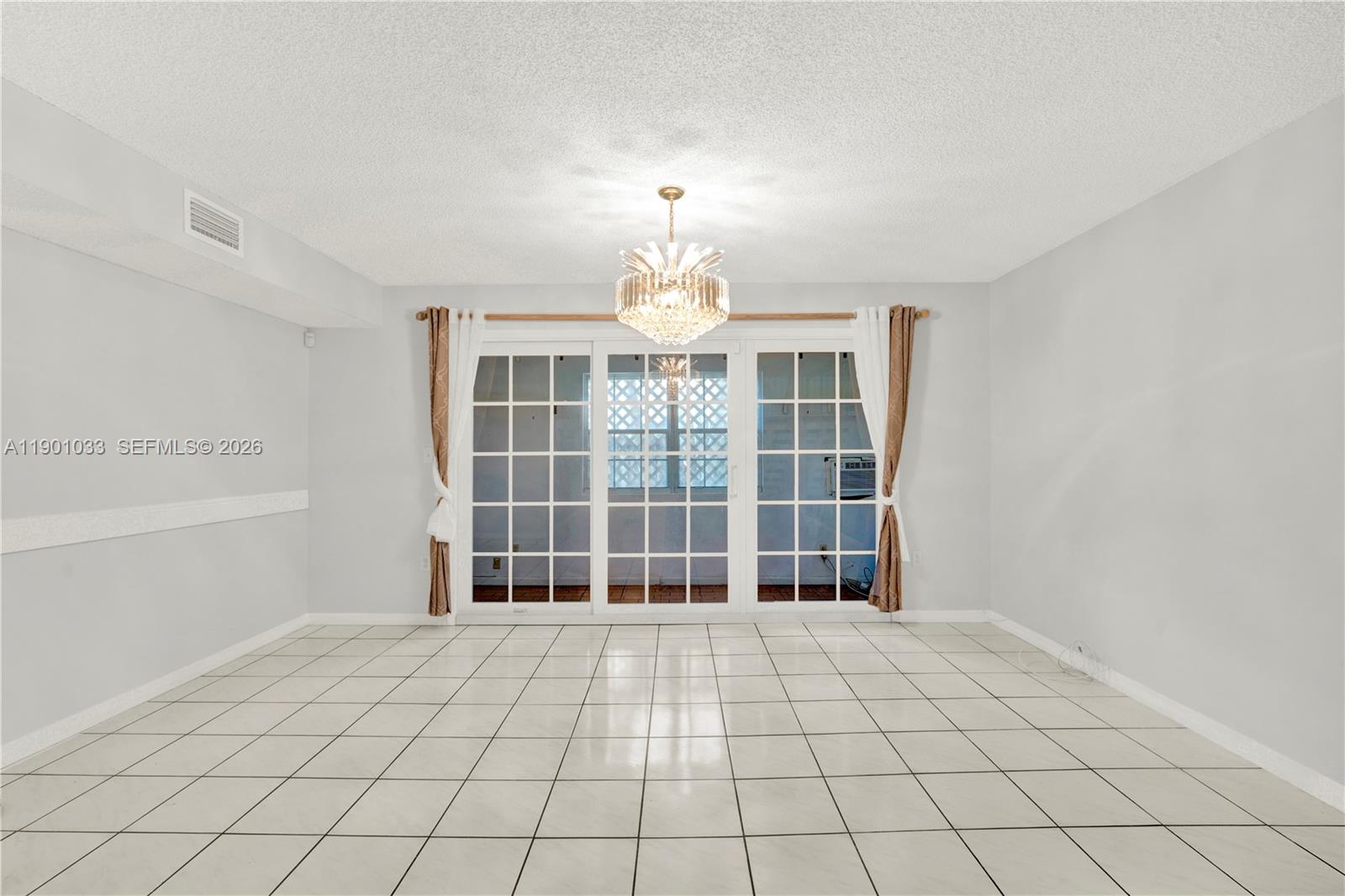 10825 Southwest 91st Lane Miami, FL 33176 - Photo 14 of 52 a view of an empty room with a window