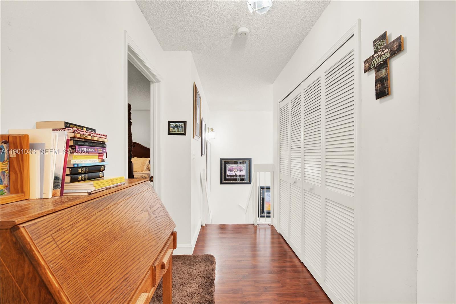 10825 Southwest 91st Lane Miami, FL 33176 - Photo 20 of 52 a view of a hallway with wooden floor and staircase