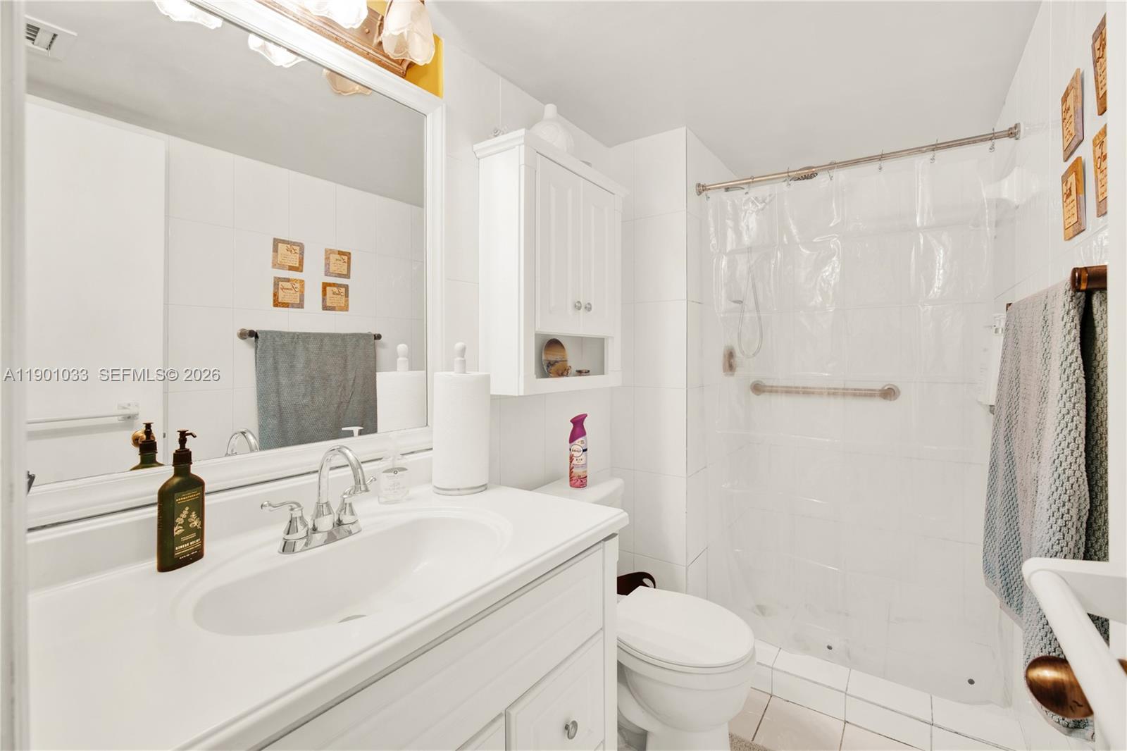 10825 Southwest 91st Lane Miami, FL 33176 - Photo 25 of 52 a bathroom with a sink toilet and shower