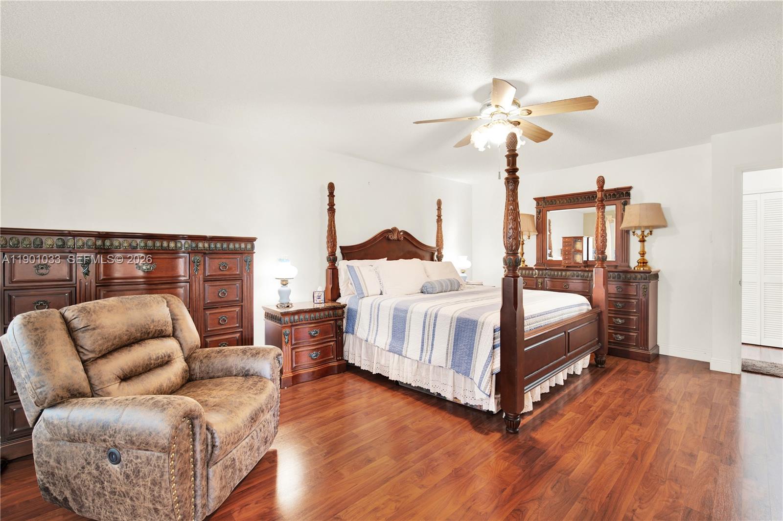 10825 Southwest 91st Lane Miami, FL 33176 - Photo 26 of 47 a bedroom with a bed couch and window