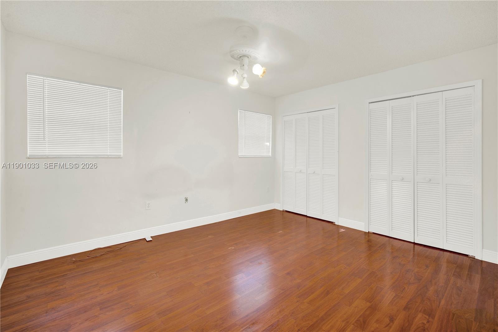 10825 Southwest 91st Lane Miami, FL 33176 - Photo 30 of 52 a view of an empty room with wooden floor