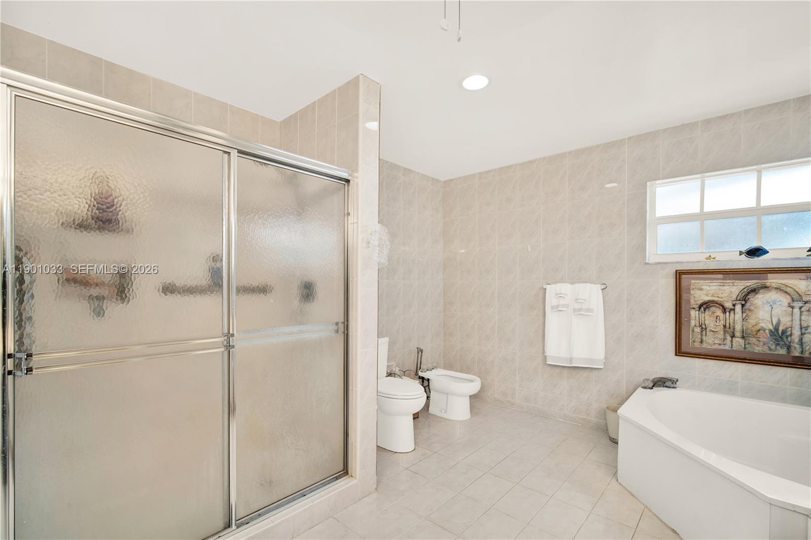 10825 Southwest 91st Lane Miami, FL 33176 - Photo 30 of 47 a bathroom with a bathtub toilet and a shower