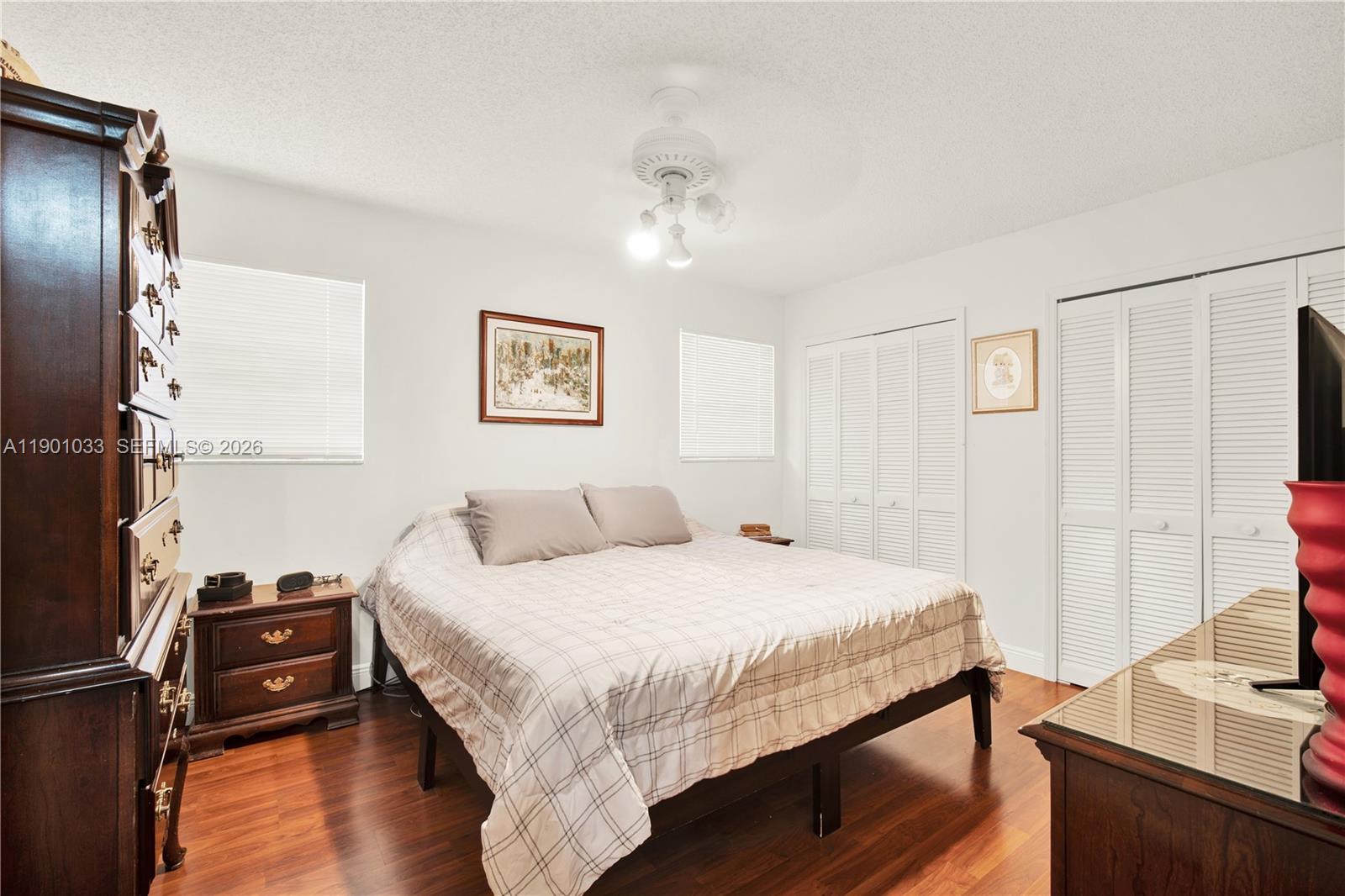 10825 Southwest 91st Lane Miami, FL 33176 - Photo 32 of 47 a bedroom with a bed and a flat screen tv