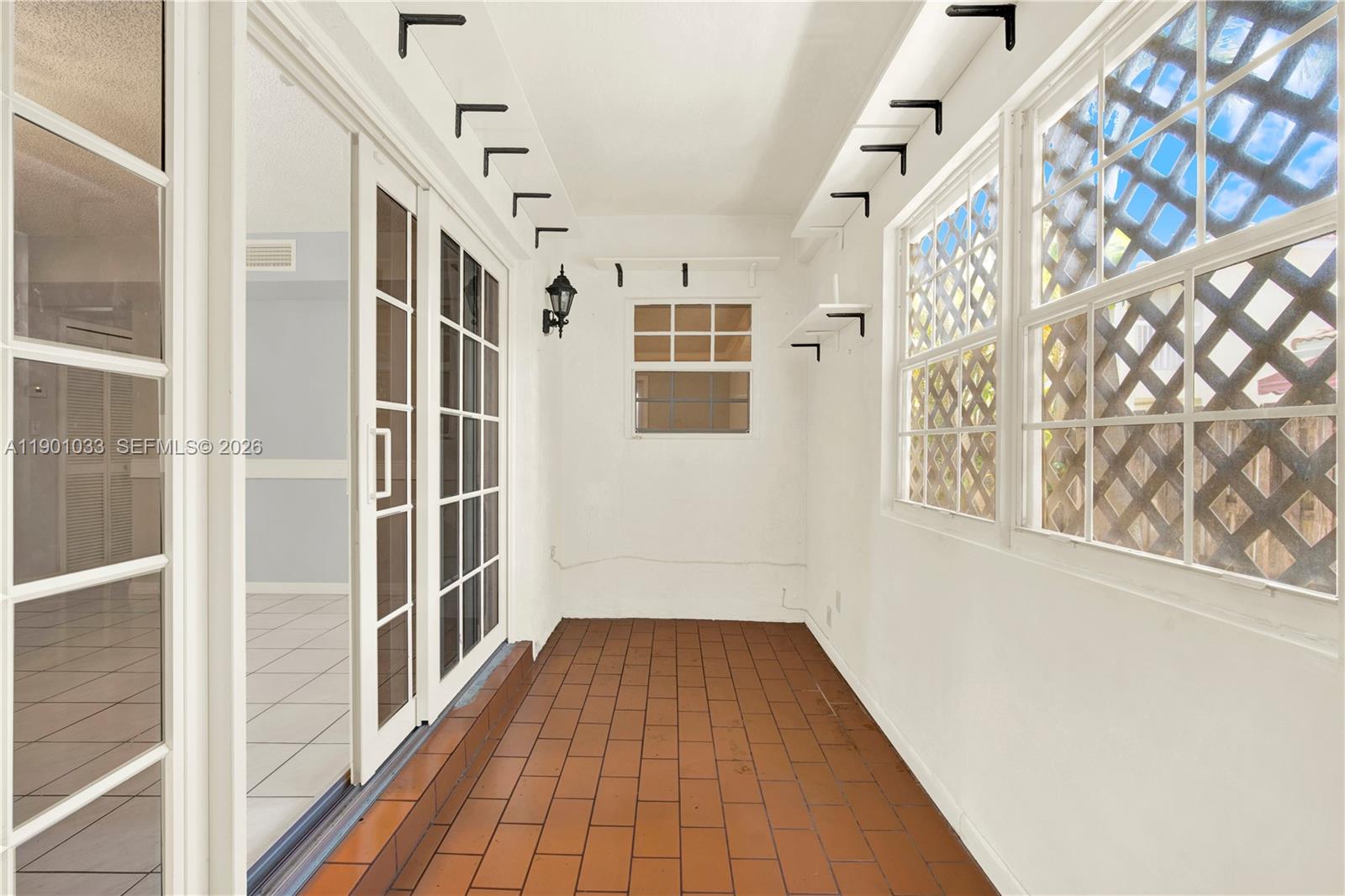 10825 Southwest 91st Lane Miami, FL 33176 - Photo 36 of 52 a view of a hallway with wooden floor and staircase