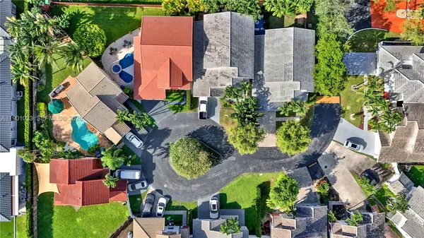 an aerial view of residential house with outdoor space and parking