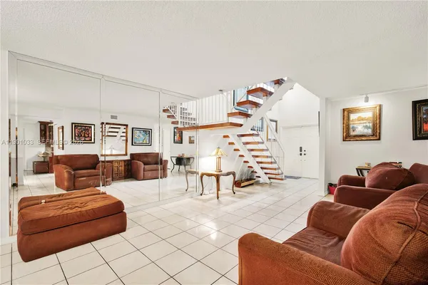 a living room with furniture and a couch