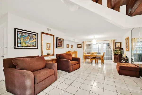 a living room with furniture and a table