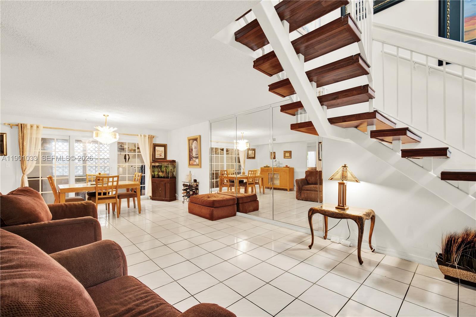 10825 Southwest 91st Lane Miami, FL 33176 - Photo 9 of 47 a living room with furniture and hard wood flooring