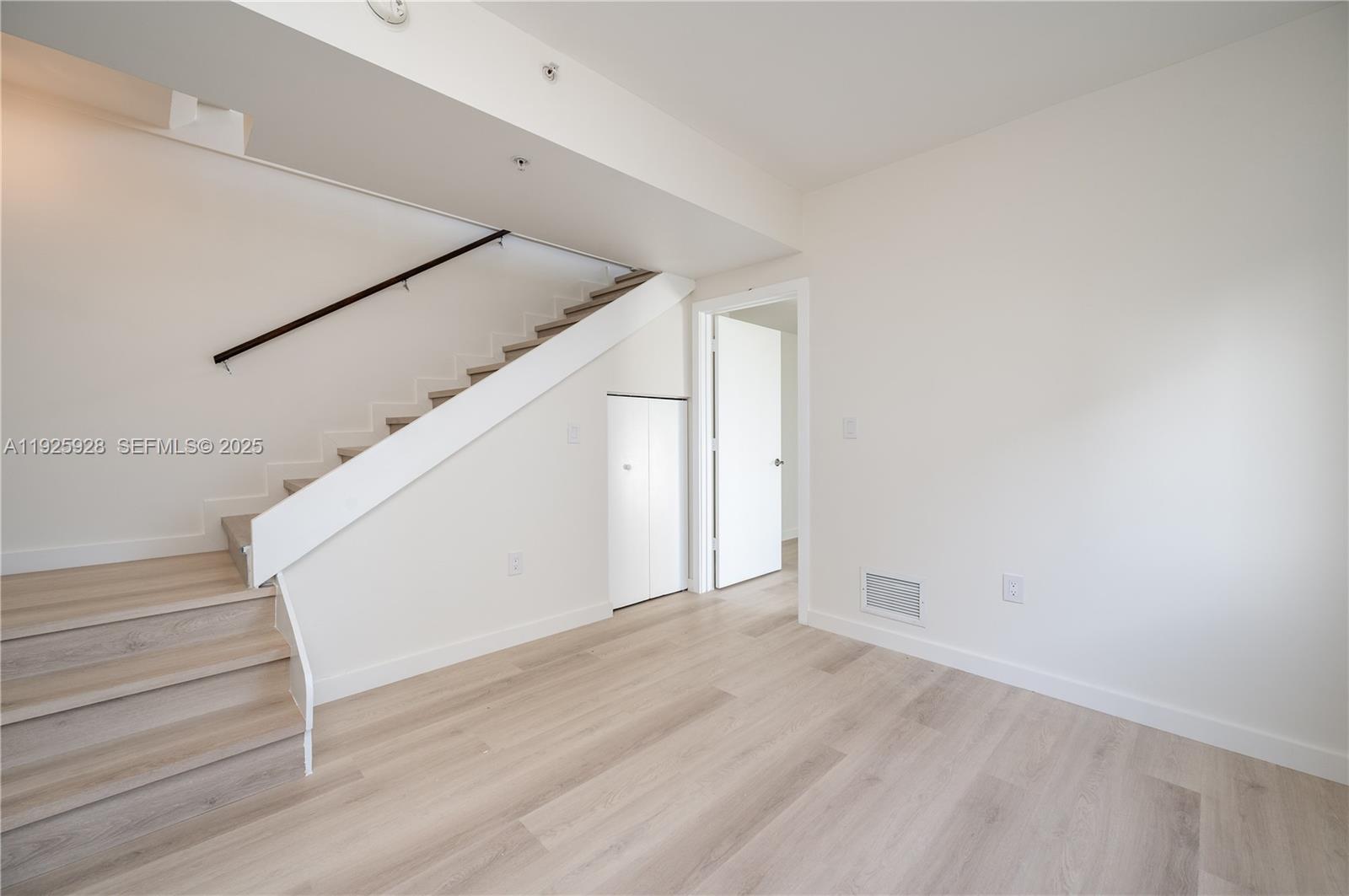 1712 Southwest 2nd Avenue, Unit 802 Miami, FL 33129 - Photo 11 of 30 a view of entryway and hall with wooden floor