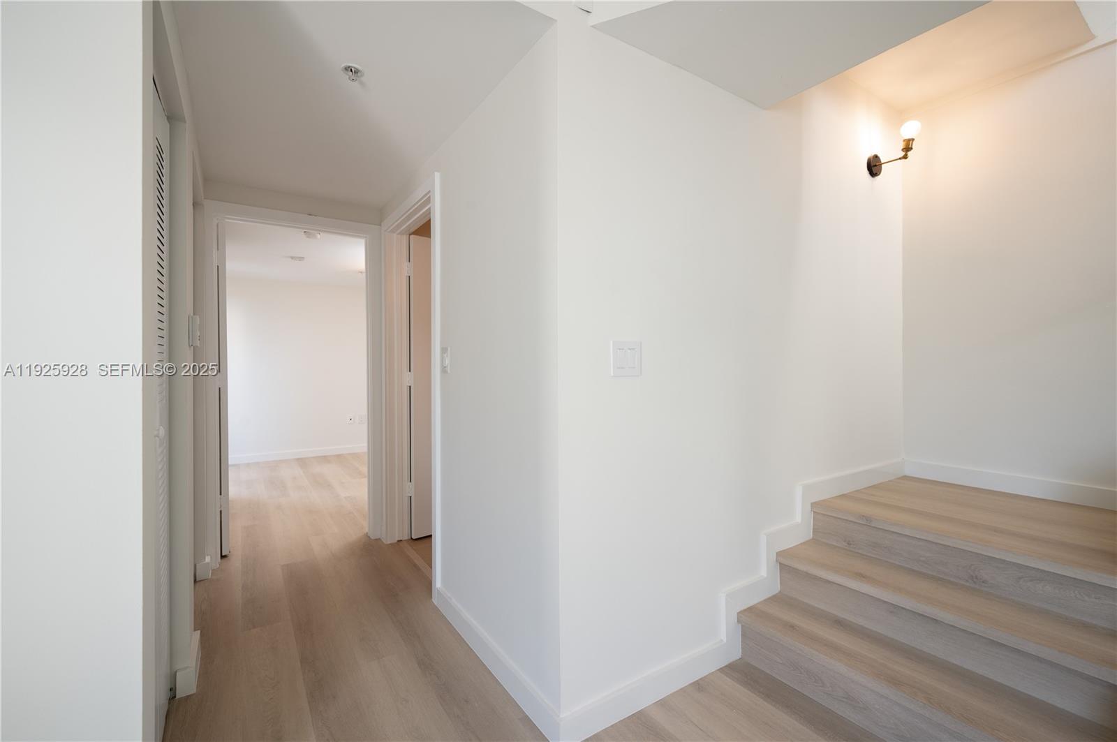 1712 Southwest 2nd Avenue, Unit 802 Miami, FL 33129 - Photo 21 of 30 a view of a hallway with wooden floor