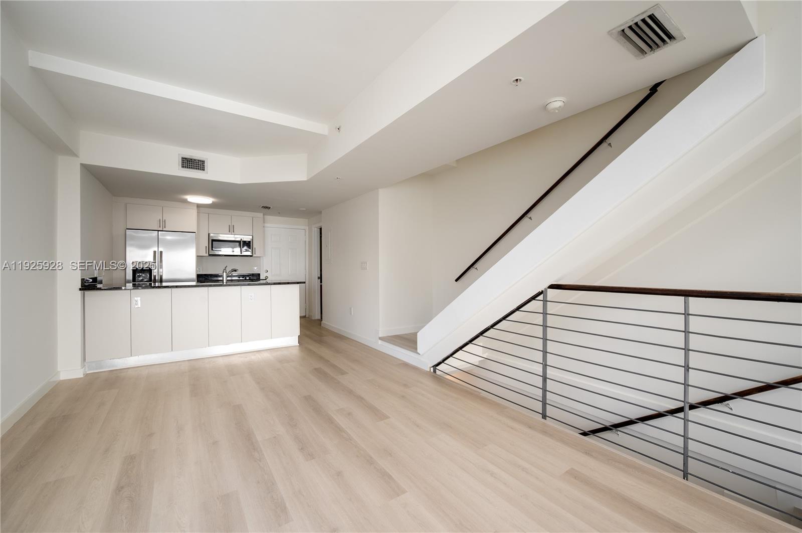 1712 Southwest 2nd Avenue, Unit 802 Miami, FL 33129 - Photo 6 of 30 a view of kitchen with sink and refrigerator