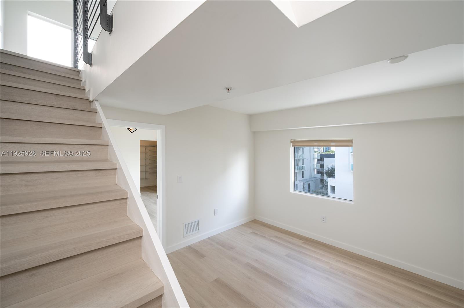 1712 Southwest 2nd Avenue, Unit 802 Miami, FL 33129 - Photo 10 of 30 a view of entryway and hall with wooden floor