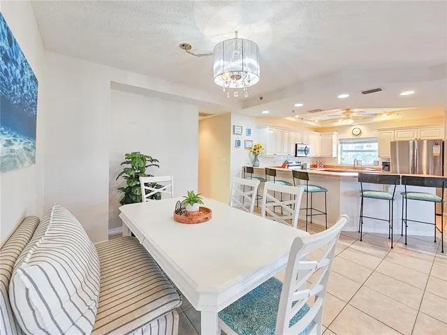 a view of a balcony dining table and chairs