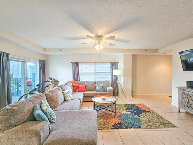 a view of a dining room with tables and chairs
