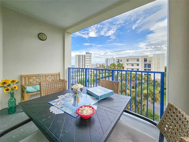a view of a porch with a floor to ceiling window