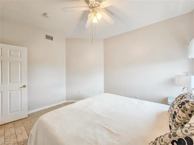 an aerial view of a house with a yard and garden