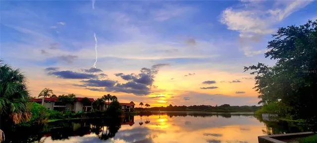 a view of swimming pool with seating space