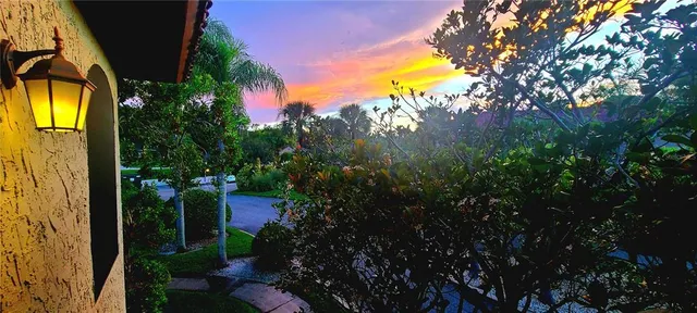 an aerial view of a house with a yard and garden