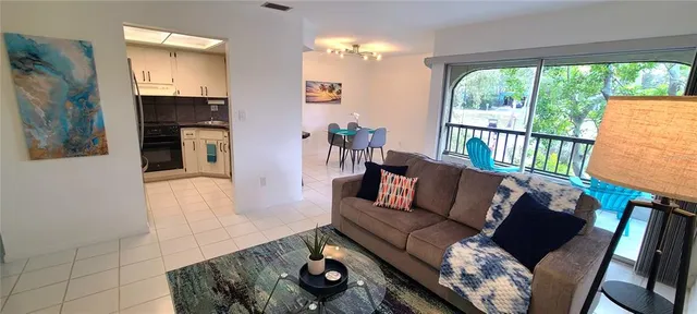 a living room with furniture and a window