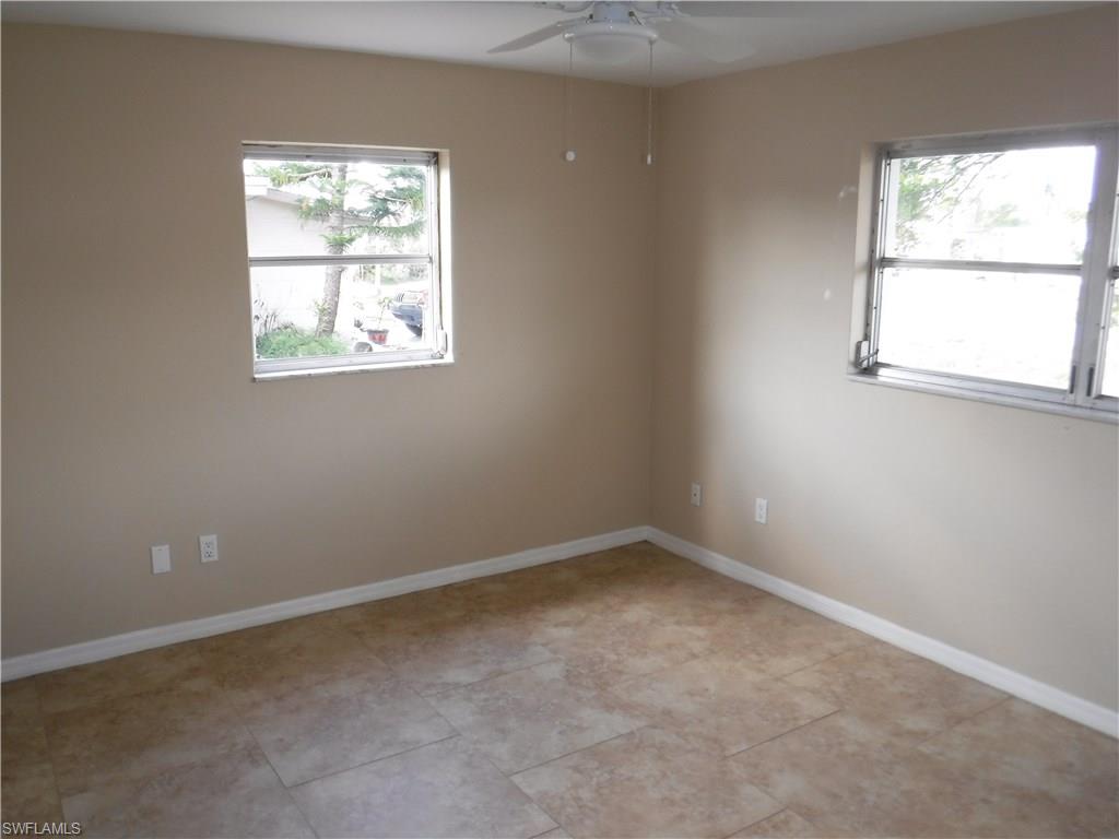 106 Oleander Road Lehigh Acres, FL 33936 - Photo 12 of 17 an empty room with a window